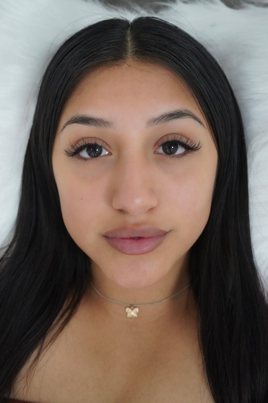 Front-facing portrait showing a softly defined Classic lash set.