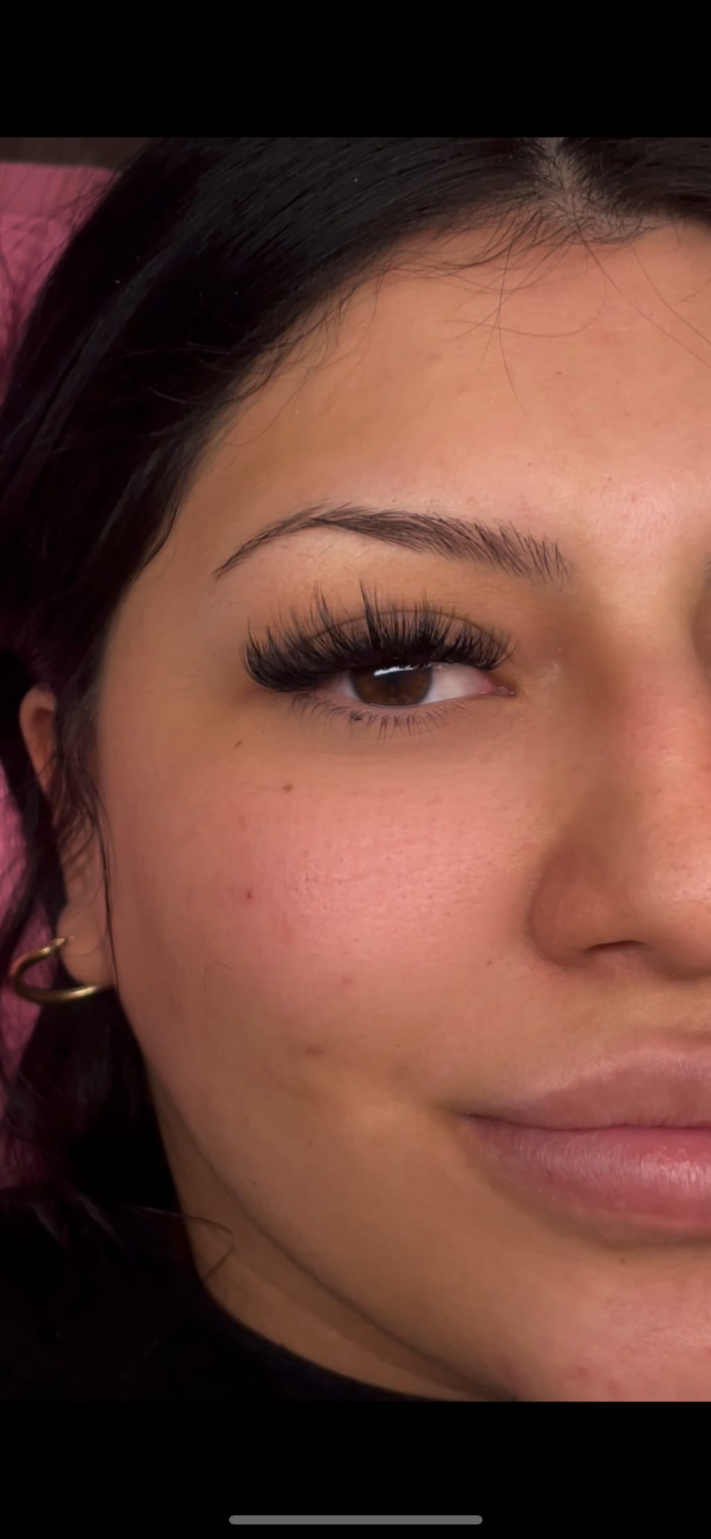 Close-up of one eye highlighting a full lash look.