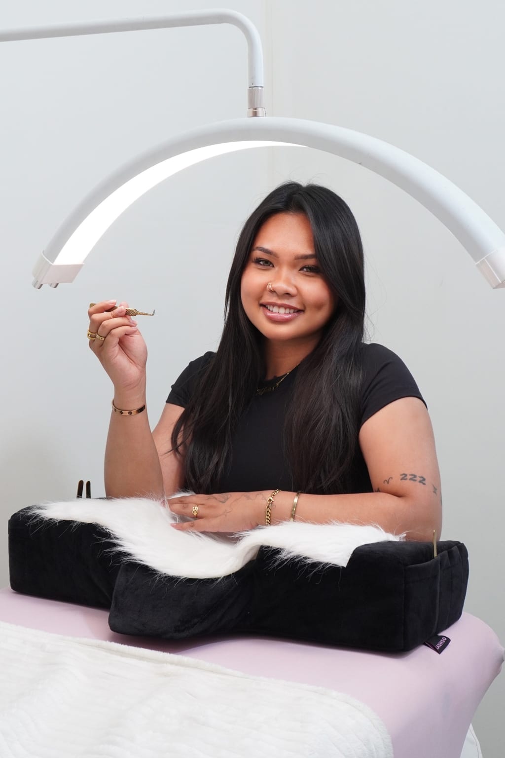Jewels seated behind a cushioned lash bed.