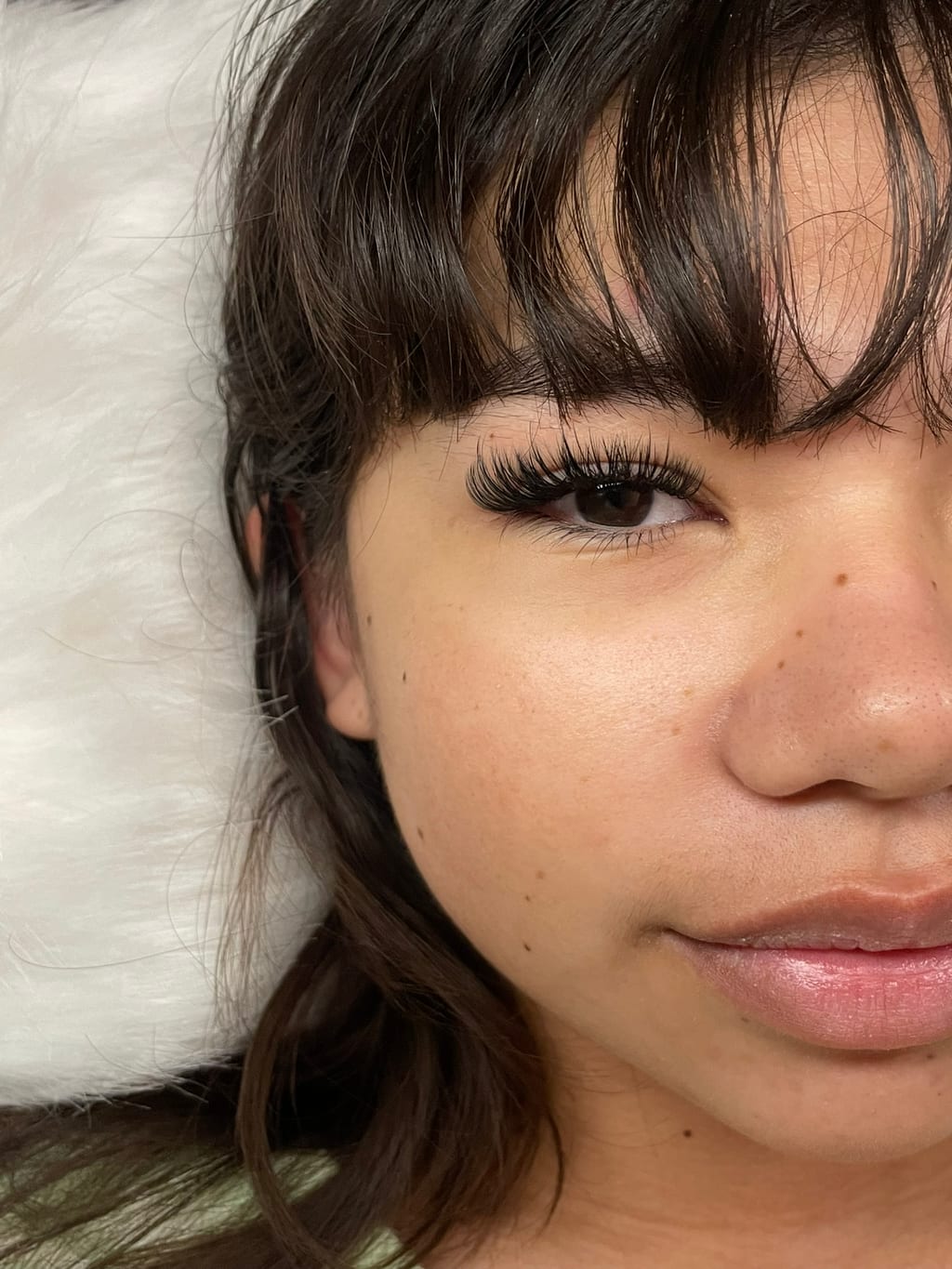 Close-up of an eye framed by a finished lash extension set.